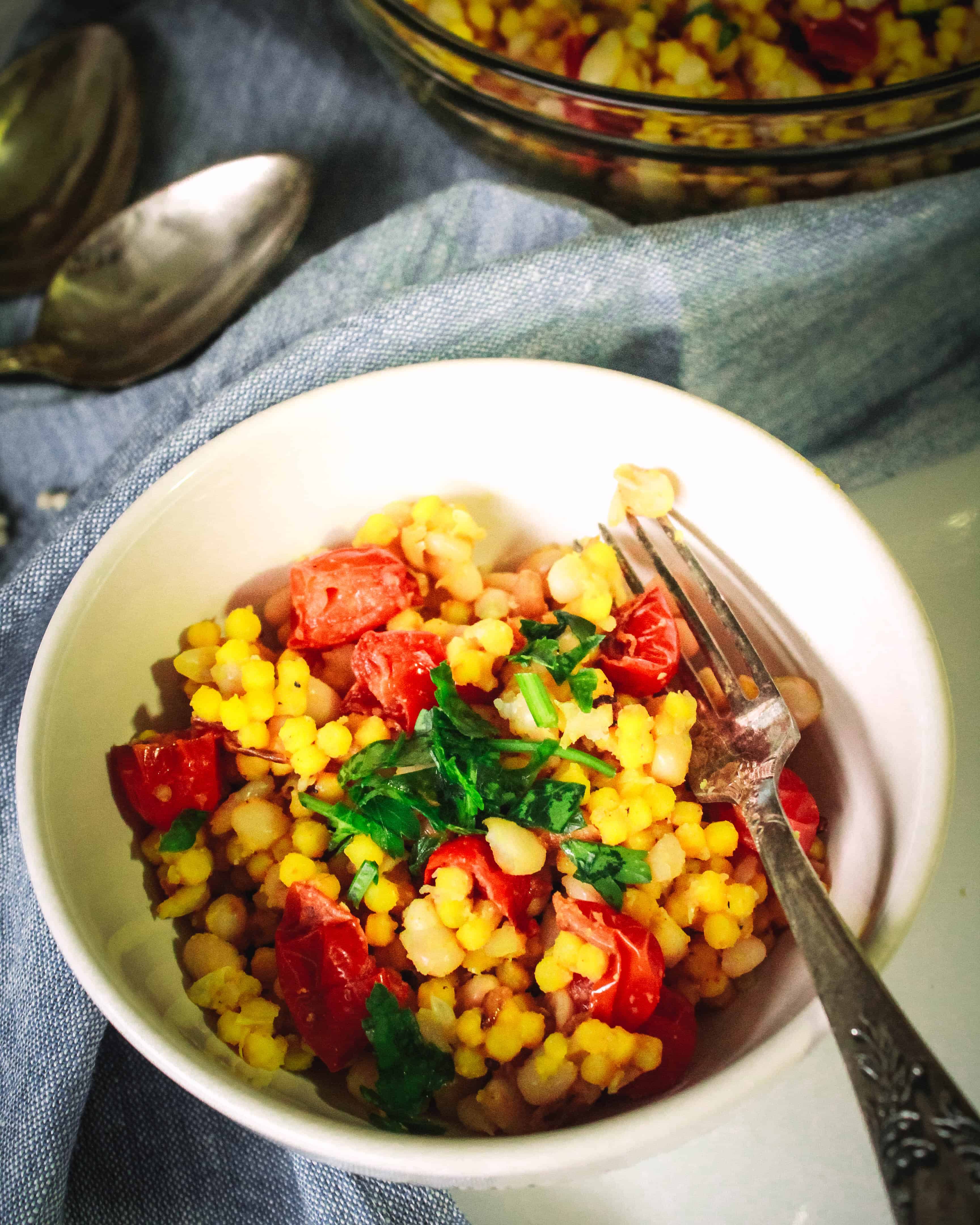 Turmeric Couscous with Navy Beans and Cherry Tomatoes