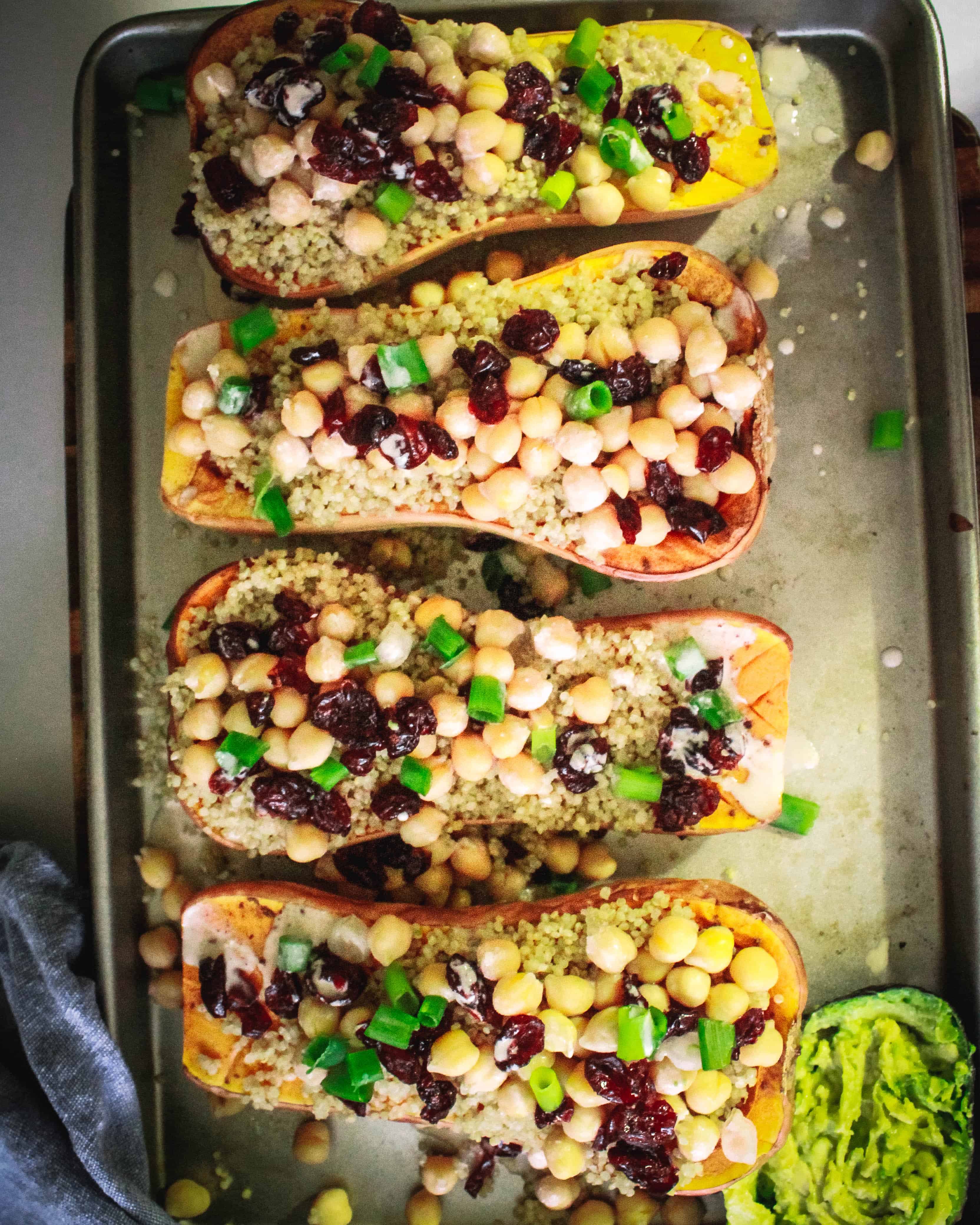 Butternut Squash halves stuffed with quinoa, cranberries, and chickpeas