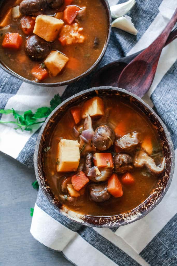I made this Hearty Root Vegetable Mushroom Stew over the weekend and it was so delicous! It's a healthy, easy, vegetairian stew stove top recipe that will become your go-to on cold winter nights! #stew #vegan #veganrecipe #vegetarian