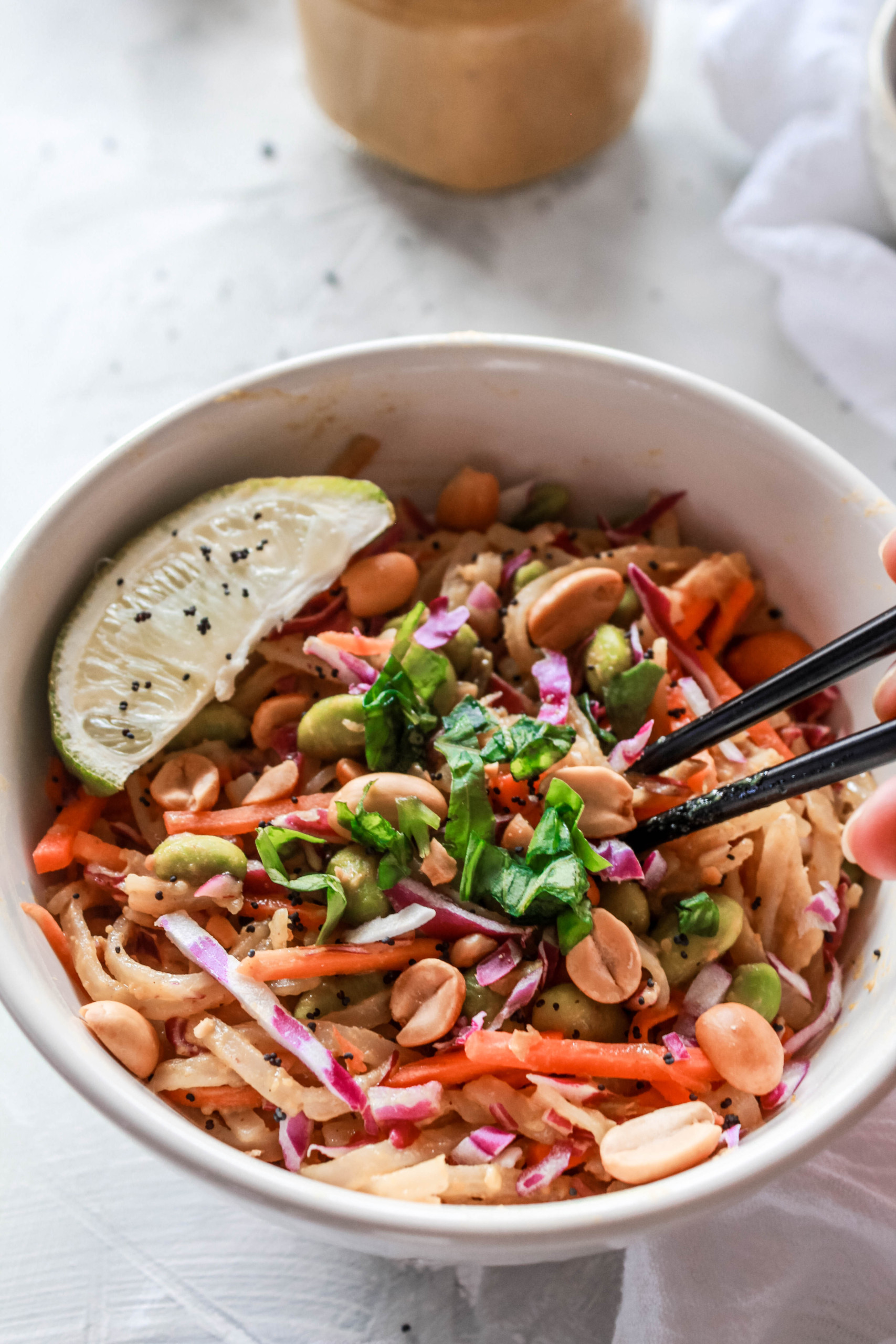 Vegan Thai Peanut Noodle Bowl that is easy to make, subtly spicy, and packed with protein! #thai #peanut #noodles