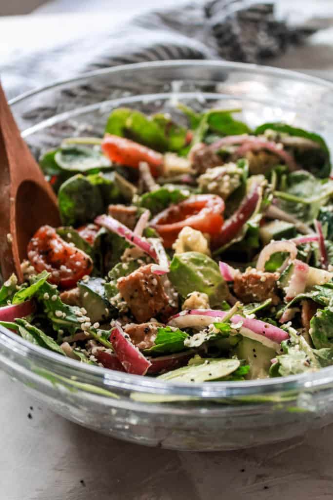 This delicious, easy-to-make Spinach Tempeh Salad recipe is packed with protein, healthy fats, full of great flavor, and tossed with tahini dressing. #salad #spinach #tempeh