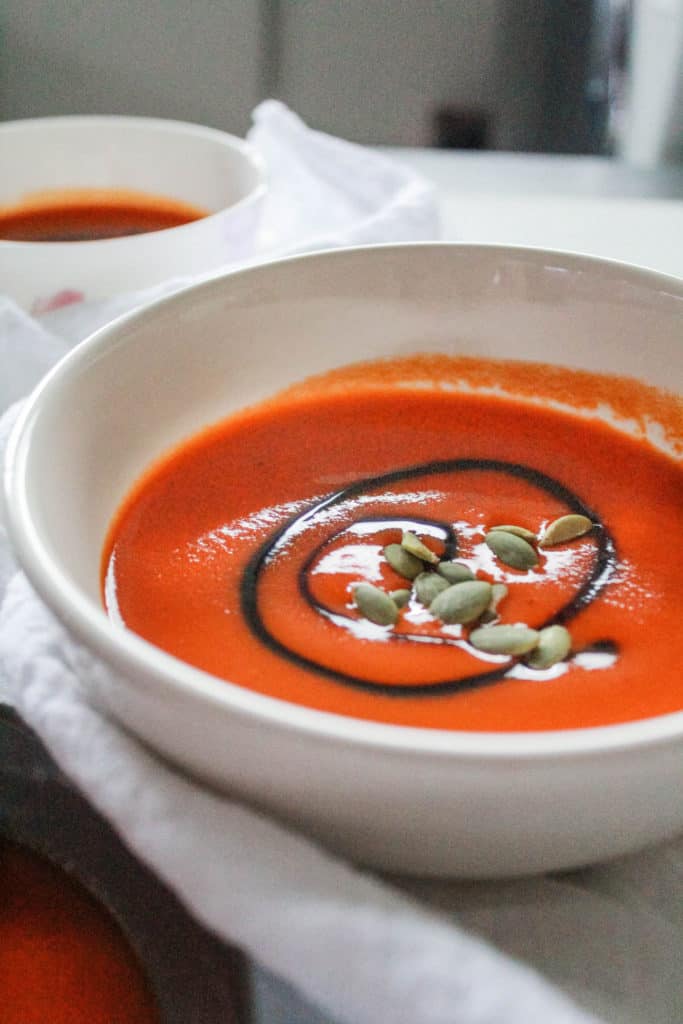 Healthy Roasted Red Pepper Soup that’s delicious hot or cold. It’s the perfect way to get your veggies for the day! #soup #veganrecipe #redpepper