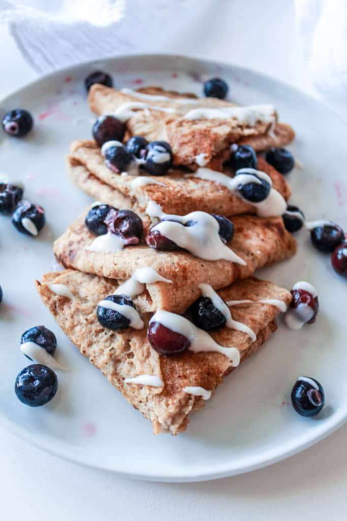 Easy vegan 100% whole wheat crepe recipe that is perfect for breakfast or dessert. Fill it with fruit, chocolate nut butter, or a vegan whip cream! #crepe #creperecipe #vegancrepe
