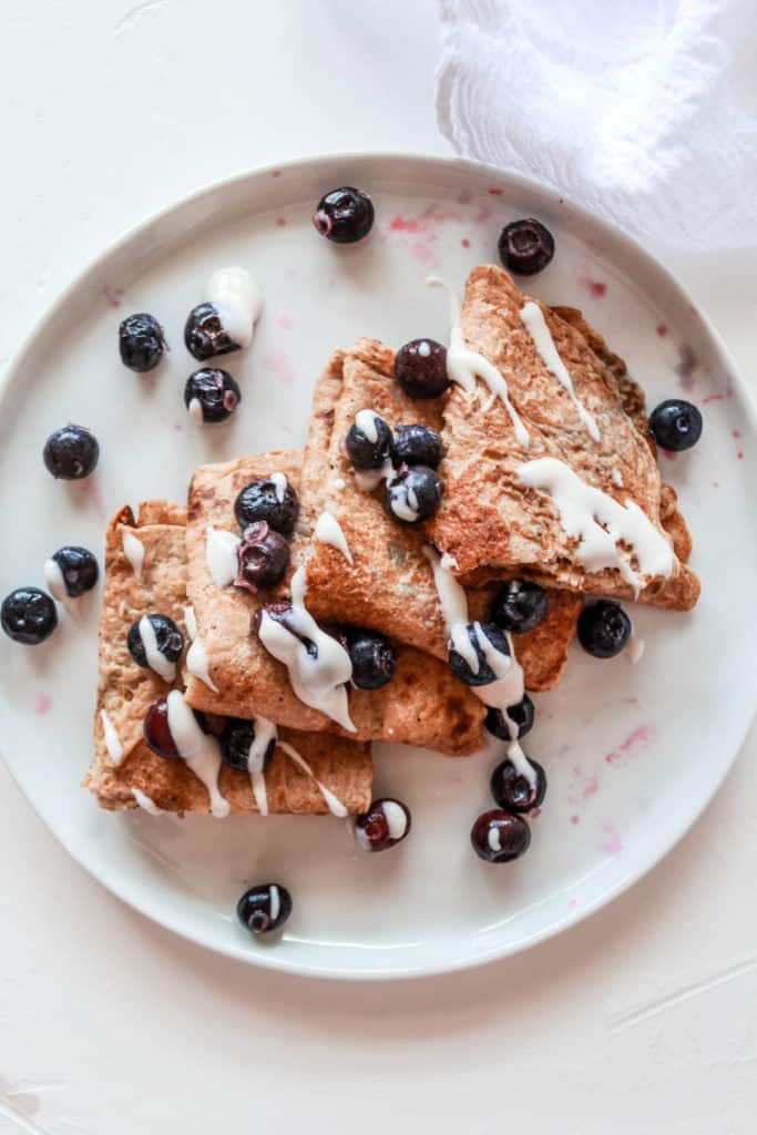 Easy vegan 100% whole wheat crepe recipe that is perfect for breakfast or dessert. Fill it with fruit, chocolate nut butter, or a vegan whip cream! #crepe #creperecipe #vegancrepe