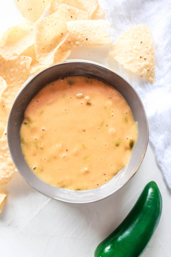 This vegan Jalapeno Queso Dip recipe is potato-based and is nut free and dairy-free. It’s a perfect party appetizer to enjoy with tortilla chips or veggies! #veganqueso #dairyfree #nutfree