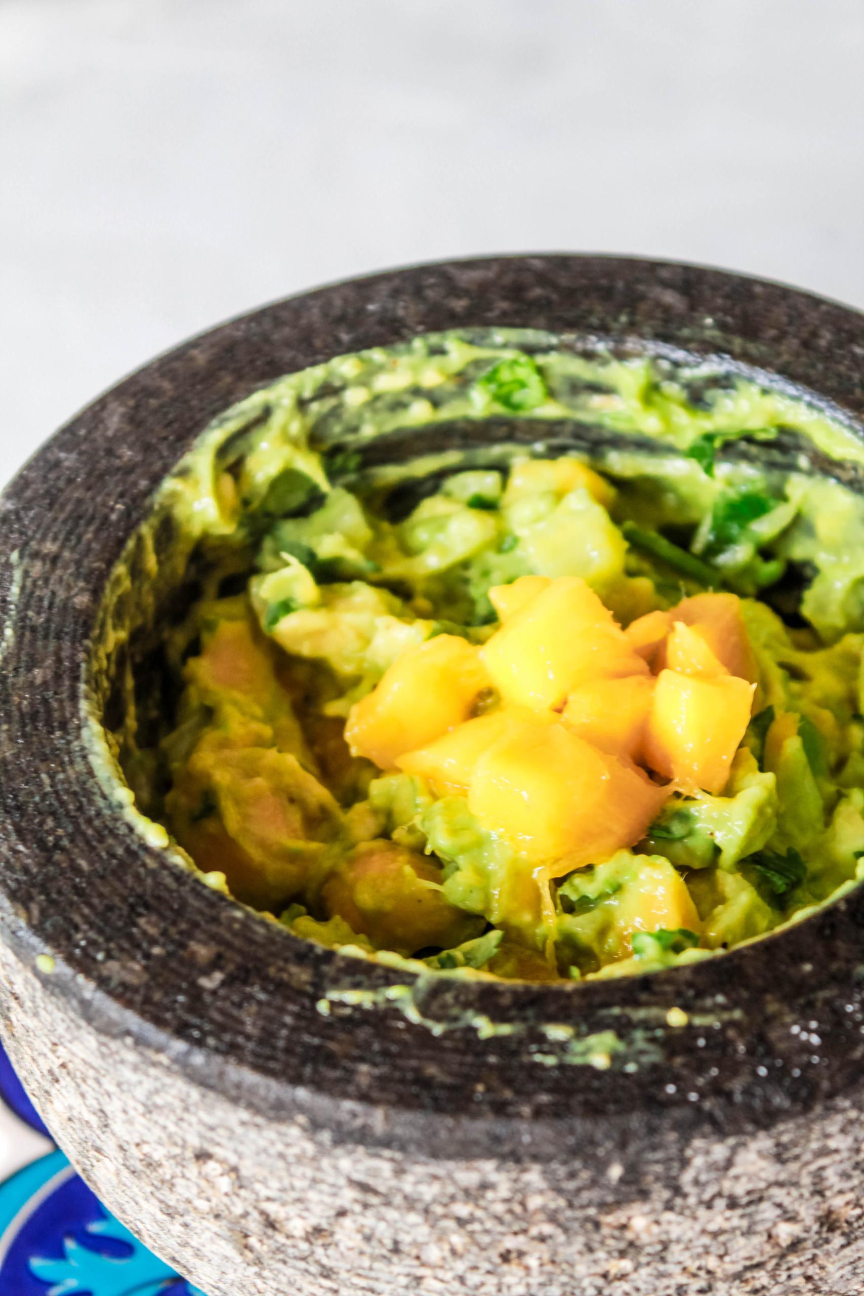 Easy, homemade, Chunky Mango Guacamole recipe that is perfect for a crowd or as a snack! #mango #guacamole #veganappetizer