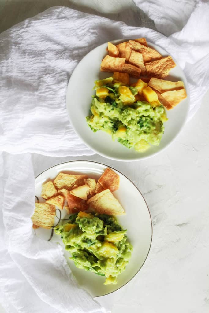 Easy, homemade, Chunky Mango Guacamole recipe that is perfect for a crowd or as a snack! #mango #guacamole #veganappetizer