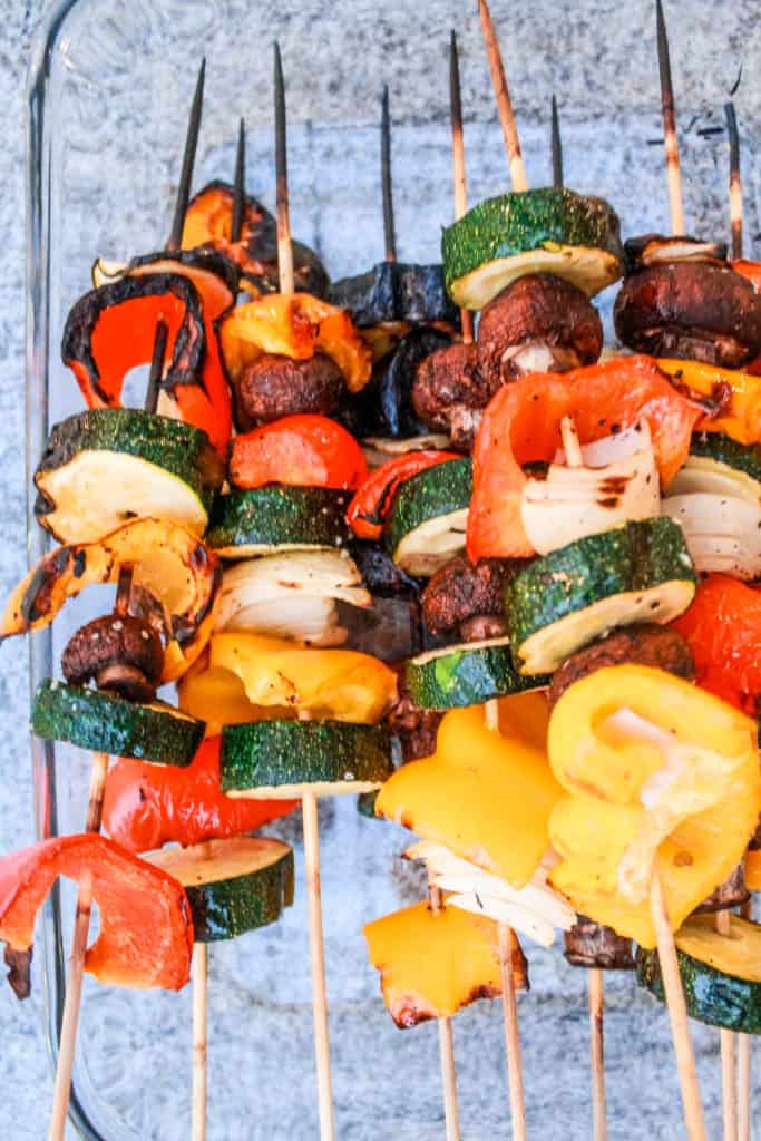 These delicious vegetable kabob skewers are a great summer meal idea. Make them on the grill or in the oven! #veggiekabobs #vegetableskewers #skewers