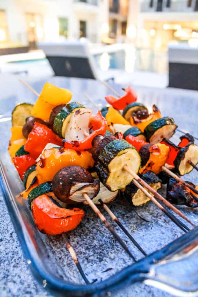 These delicious vegetable kabob skewers are a great summer meal idea. Make them on the grill or in the oven! #veggiekabobs #vegetableskewers #skewers