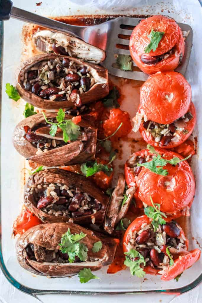 Put them eggplants to good use in this delicious meal! Stuffed with brown rice and kidney bean, these vegetables transform into a hearty, satisfying entrée! #eggplants #plantbased #vegetarian #vegan #glutenfree