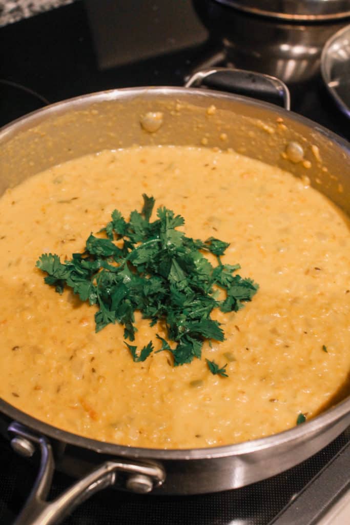 Classic red lentil dhal curry recipe ready in 30-minutes! It makes a quick, healthy and delicious weeknight meal! #dhal #vegan #redlentils