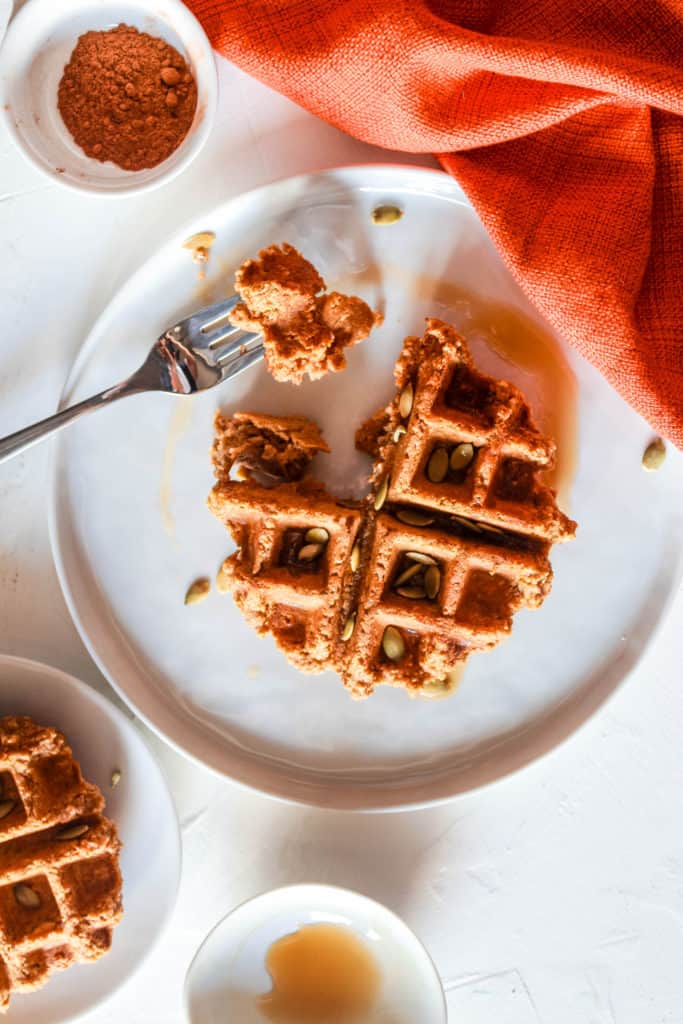 Easy, healthy, vegan pumpkin waffles that are crispy on the outside and moist on the inside! They make a delicious, fall breakfast! #pumpkin #waffles #healthy