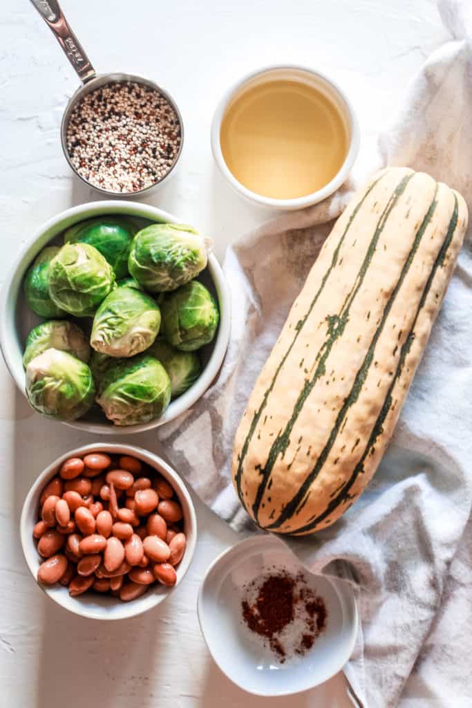 This healthy, plant-based bowl is perfect as an autumn lunch or dinner. It’s high in protein and comes with a delicious, creamy maple sauce! #fallrecipe #grainbowl #delicata