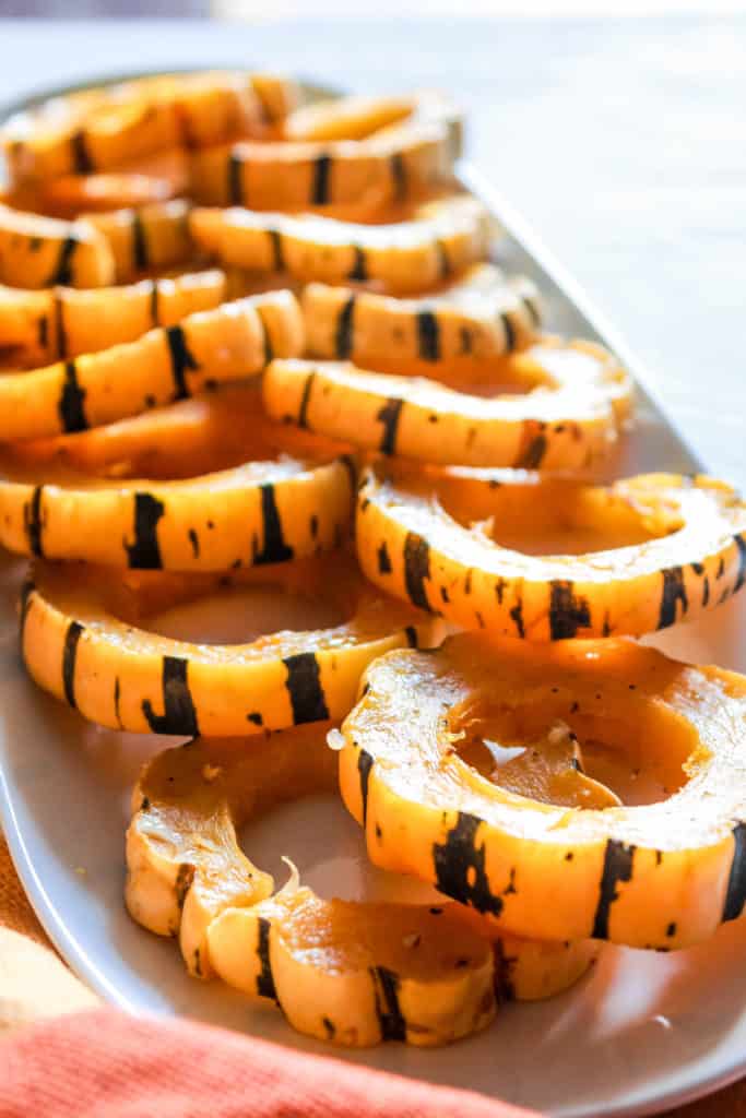 Learn the trick to make delicious, roasted Delicata squash fast that’s perfect for fall and winter meals! #delicata #squash