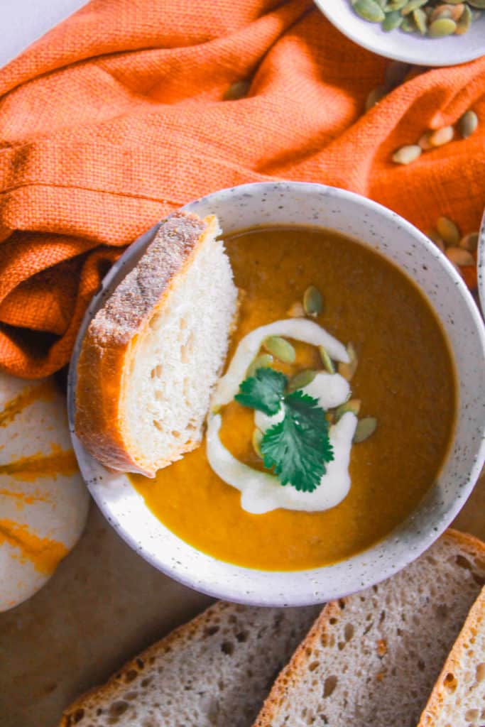 Make this healthy, pumpkin soup in under 30 minutes! It’s creamy, vegan, dairy-free, and mildly sweet! #healthy #vegan #dairyfree