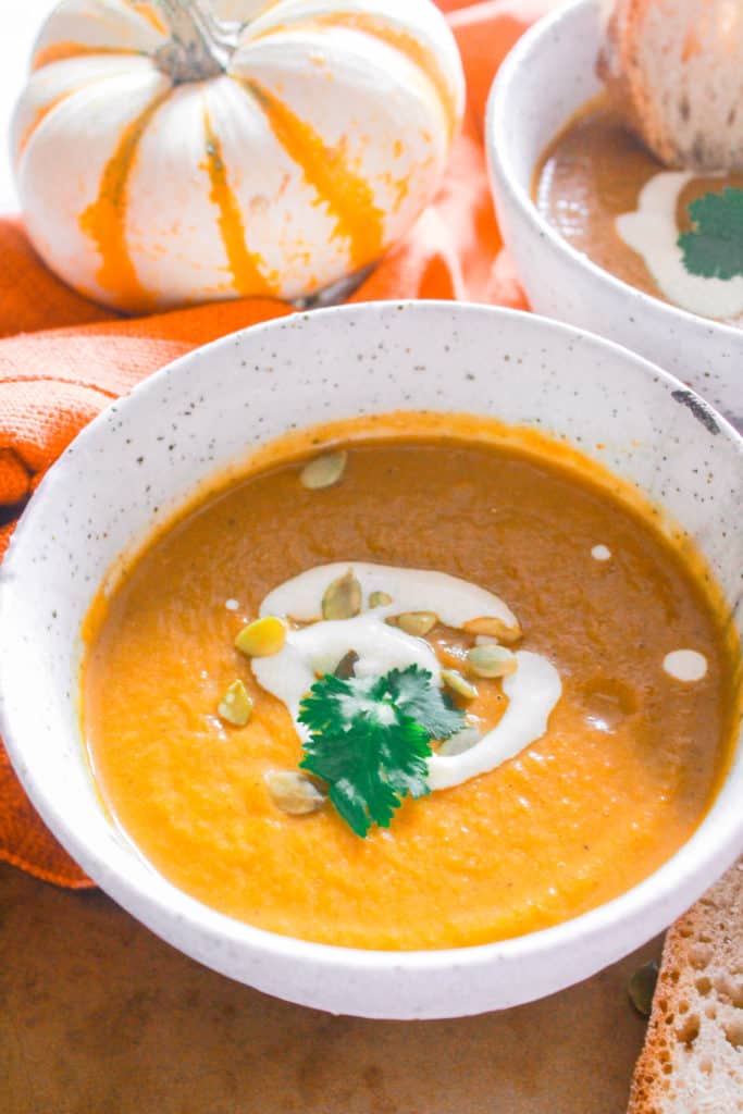 Make this healthy, pumpkin soup in under 30 minutes! It’s creamy, vegan, dairy-free, and mildly sweet! #healthy #vegan #dairyfree