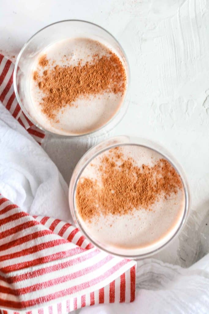 Easy, homemade, and comforting eggnog recipe that is made with natural sugar. It’s perfect for spiking for the holidays or a cold winter night! #eggnog #vegan #dairyfree