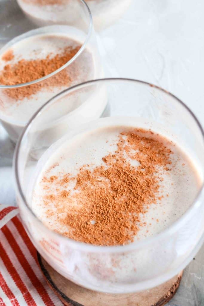 Easy, homemade, and comforting eggnog recipe that is made with natural sugar. It’s perfect for spiking for the holidays or a cold winter night! #eggnog #vegan #dairyfree