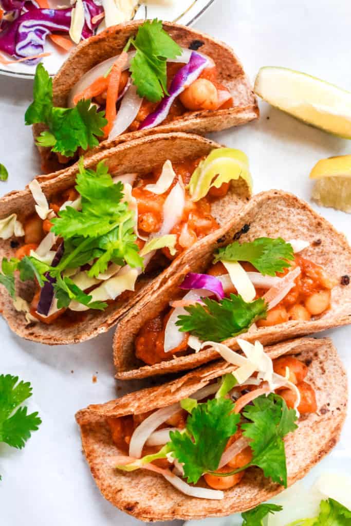 Authentic, Mexican, saucy tacos make an easy vegan dinner! These tacos are healthy and you can adjust the spice level to your liking. #tacos #tinga #veganmeal