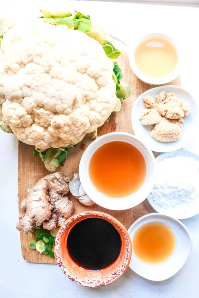 Try this healthy spin on a classic Chinese takeout. Baked cauliflower with delicious sticky-sweet Sesame sauce is an easy, go-to vegan meal! #sesame #cauliflower #vegan