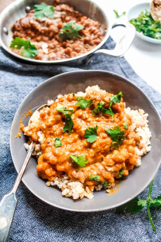 Easy, creamy authentic Indian curry recipe that comes together in 30 minutes! It’s delicious for lunch or dinner and makes excellent leftovers! #coconutcurry #lentilcurry #vegancurry